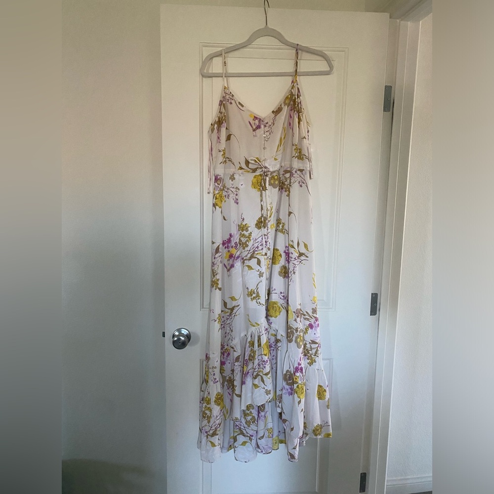 Cream floral dress. Yellow and purple flowers.